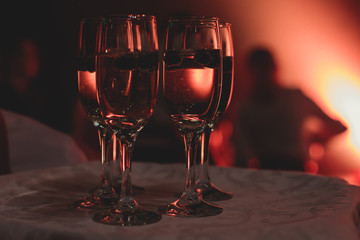 View of alcohol setting on catering banquet table, row line of different colored alcohol cocktails on a party, martini, vodka, and others on decorated catering bouquet table event
