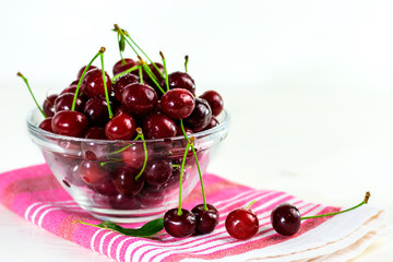 Fresh sour cherries in glass bowl