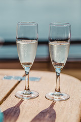 Wedding glasses and rings. Wedding glasses with sparkling champagne and rings inside