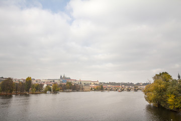 Panorama of the Old Town of Prague, Czech Republic, with a focus on Charles bridge (Karluv Most)  and the Prague Castle (Prazsky hrad) seen from the Vltava river. The castle is a touristic landmark 