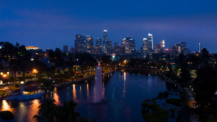 Fototapeta na wymiar JUNE 18, 2019, LOS ANGELES, CA, USA, Aerial of Los Angeles Skyline and Echo Park Lake at dusk