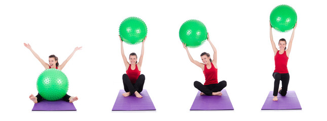 Young woman exercising with swiss ball