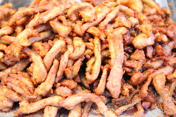 Traditional Thai food at market. Roasted spicy pork