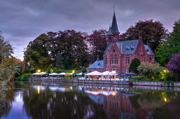 Fototapeta na wymiar Traditional ancient medieval castle in the dusk. Bruges, Belgium