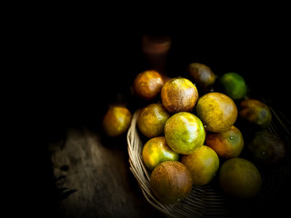 Orange fruits in the basket dark scene food backgrounds