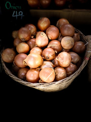 Close up onion in a basket dark scene food vegetable backgrounds