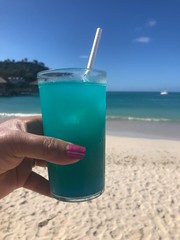 Blue Hawaii drink by the blue ocean
