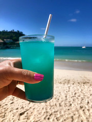 Blue Hawaii drink by the blue ocean