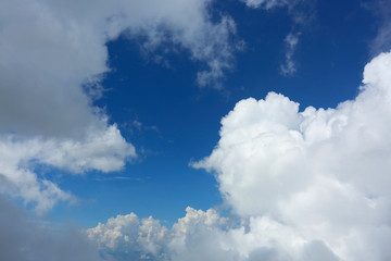 Naklejka na ściany i meble fluffy white cloud moving above dream sky background