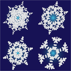 Set of isolated falling snowflakes on blue background.