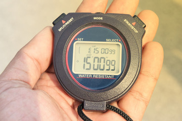 hand with stopwatch