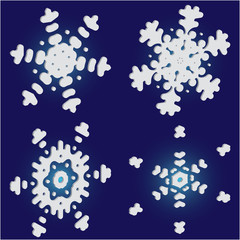 Kit of isolated  silhouettes of snowflakes on blue background.