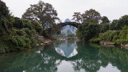 Fototapeta na wymiar Yangshuo, China - November 7, 2019: Fuli bridge in Yangshuo, Guanxi province - China