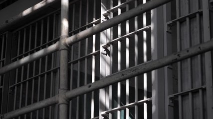 Penitentiary prison gaol jail cell iron bars correctional center B-roll