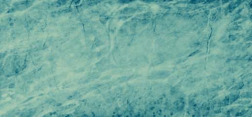 Gorgeous aquamarine blue green color background with textured grunge border with abstract cracks and paint spatter design