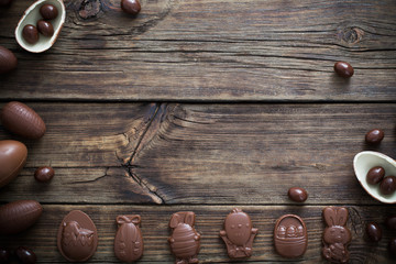 chocolate eggs on dark wooden background