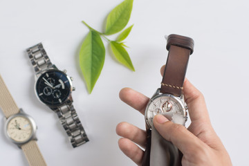 Close up cleaning modern watch with microfiber cloth and Cleaner cream concept.Cleaning modern...