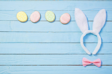 Easter decorations on blue wooden background