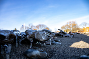 Frozen shapes of rock and sand in the beach in the winter