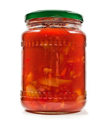 Salad vegetables canned in glass jar isolated on a white background.