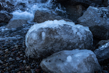 Stones and rocks covered in ice