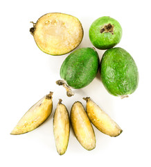 Fresh feijoa fruits (acca sellowiana, pineapple guava) with slices isolated on a white background. Top view.