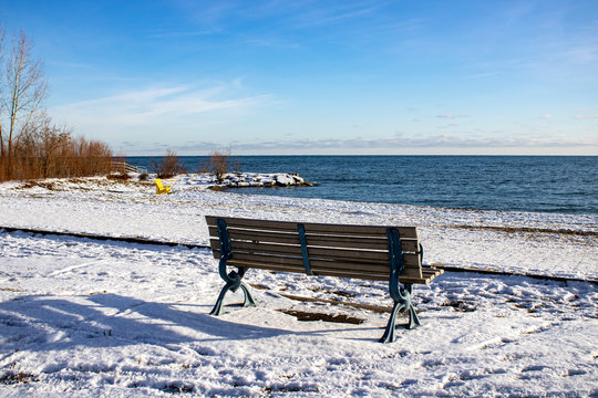 Lonely bench near the beach in the winter