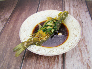Chinese tableware soy sauce steamed yellow bone fish