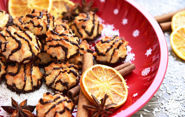 Fototapeta premium Coconut and Dark Chocolate cookies for Christmas Party with red tray and Christmas Decoration