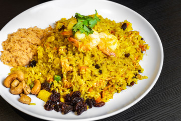 Pineapple Fried Rice, is a quick stir-fry with Thai-inspired ingredients like jasmine rice, curry, fish sauce, red bell pepper, pineapple, peas, and shrimp etc.