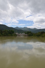 Fototapeta na wymiar a lake in the mountains in guangdong province china, vertical form