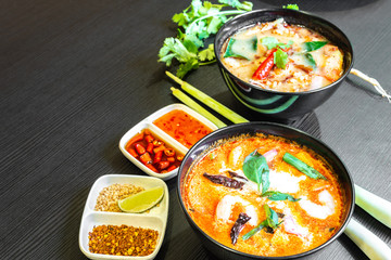 Tom Yum Soup or Tom Yam Kung is a traditional hot spicy sour soup, typical dish in Thailand, usually cooked with shrimps. Empty copy space.