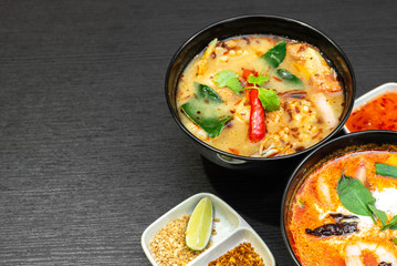 Tom Yum Soup or Tom Yam Kung is a traditional hot spicy sour soup, typical dish in Thailand, usually cooked with shrimps. Empty copy space.