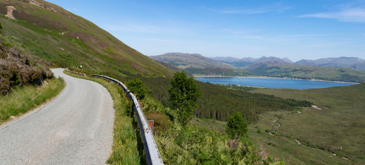 Mountain road with distant lake