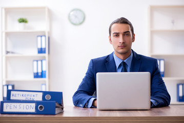 Young male accountant working in the office