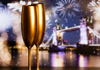 champagne glasses and fireworks  new year in London