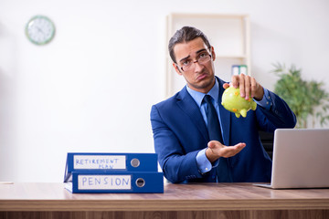 Young male accountant working in the office