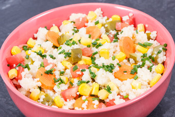 Salad with vegetables and couscous groats. Light and healthy meal containing vitamins and minerals