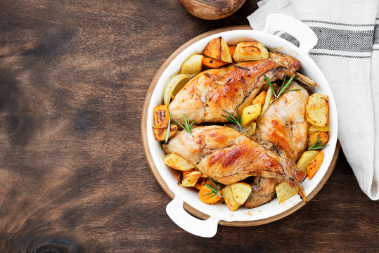 Stewed in white wine with spices rabbit legs with baked vegetables and rosemary.