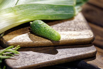 fresh cucumbers on a wooden board