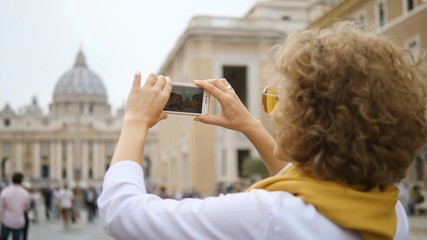 Female Tourist Taking Photo Of Landmark With Smartphone, Travel In Europe