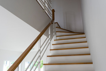 Fototapeta premium Wooden stairs in the house, looking down.