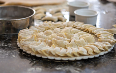 Raw dumplings or vareniks, traditional Russian and Ukrainian food,