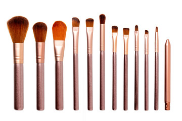 Makeup cosmetic brushes collection isolated on a white background. Top view.
