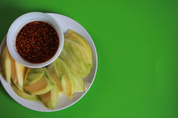 sour mangoes with chilly spicy sweet sauce