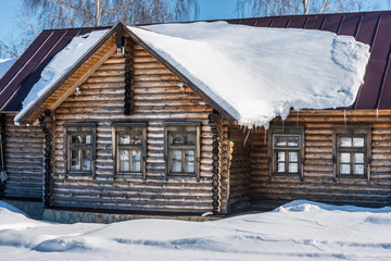 Typical old russian house covered with snow/ Winter Landscape/ Suzdal/ Russia/ Golden Ring of Russia Travel