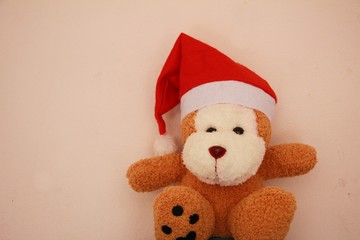 a lovely monkey doll with santa hat