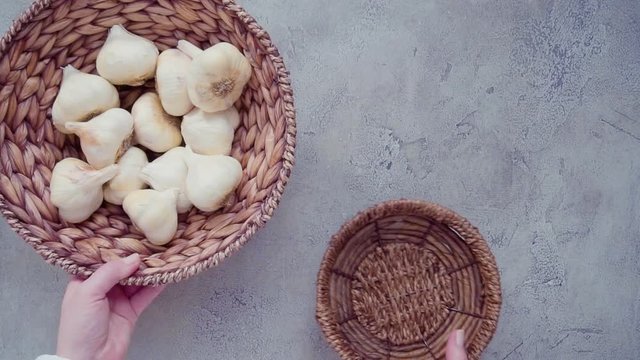 Organic garlic cloves in small basket.