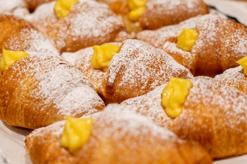 Tasty croissants with cream. Cream croissant. cornetto soft and sweet cream. cream brioche