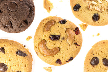 Top view of chocolate chips cookies and cashew nuts isolated on white background, flat lay of sweet and dessert with raisins seeds